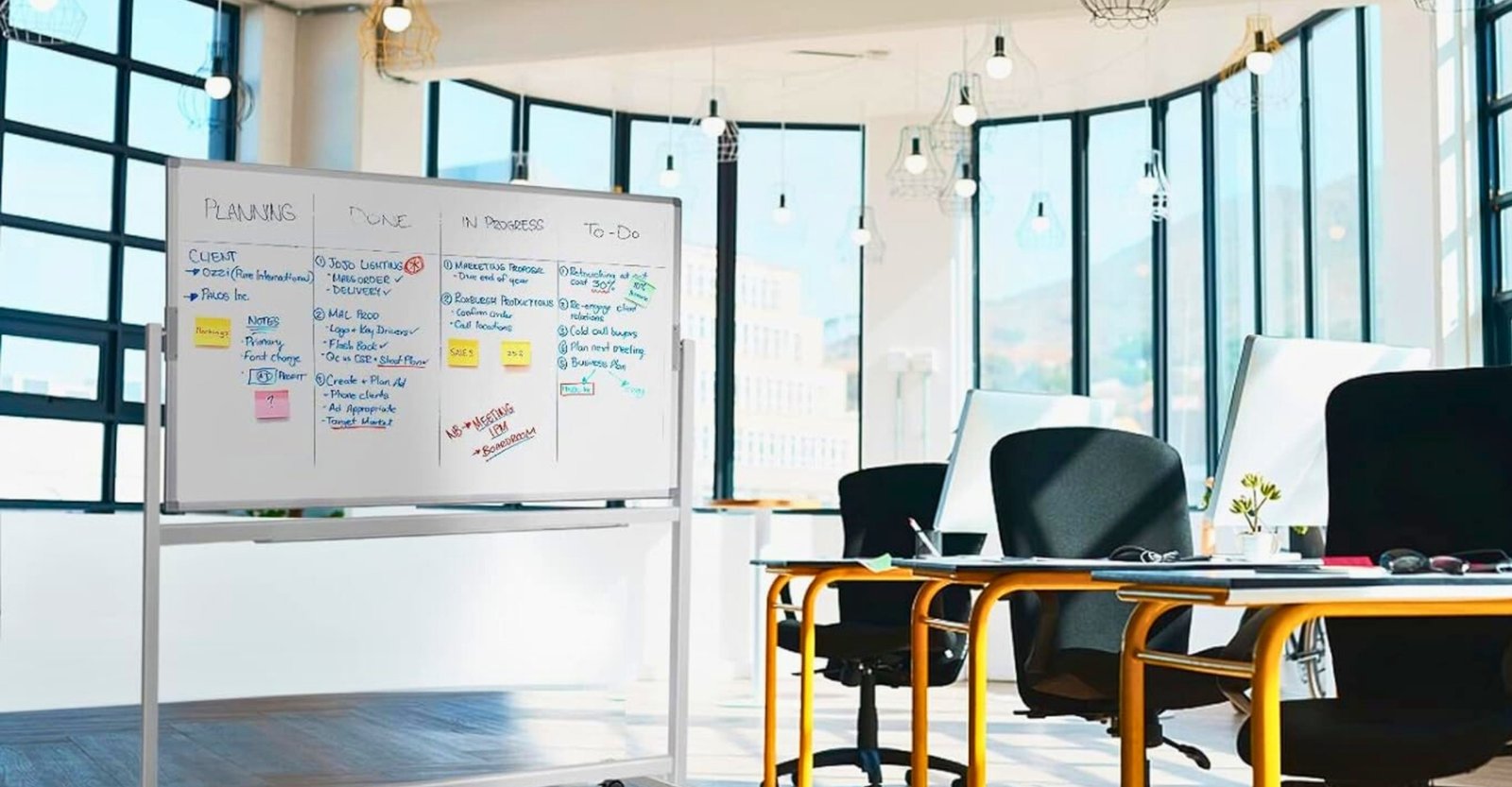 Portable and adjustable whiteboard with stand for office collaboration.